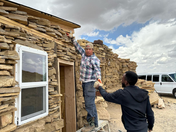 CIELO participants building the outside wall w dr Johnson