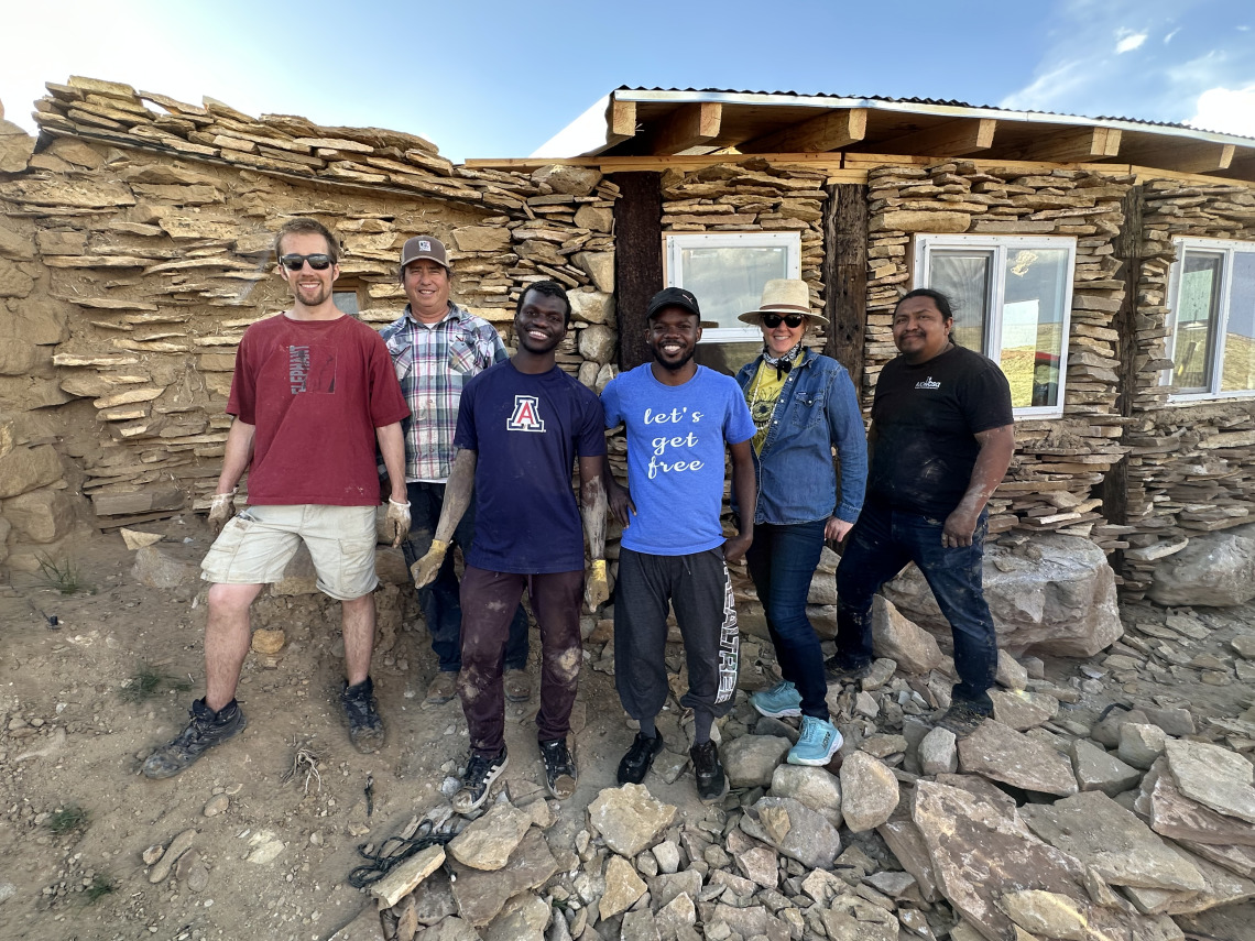 CIELO experience participants at dr. Johnson's in front of the greenhouse built